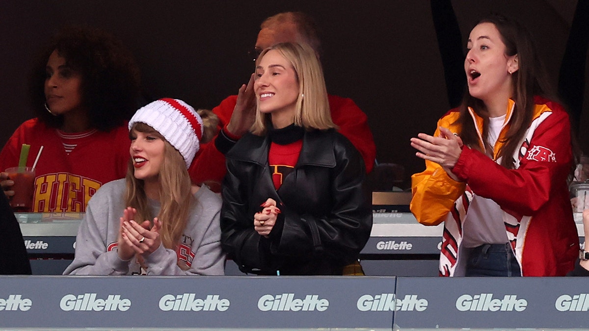 Taylor Swift claps and cheers for the Kansas City Chiefs at Gillette Stadium