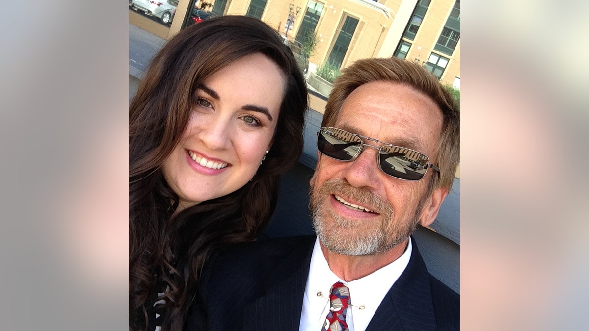 A close-up of Ashley Randele taking a selfie with her father Thomas Randele