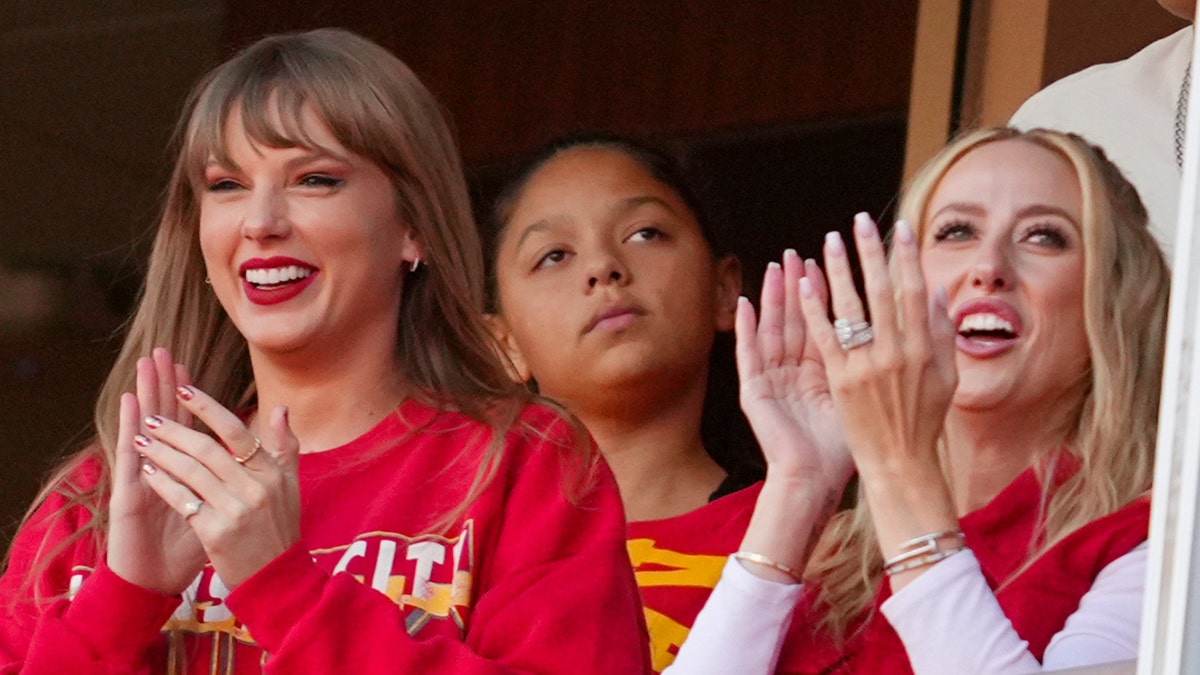 Taylor Swift and Brittany Mahomes smile
