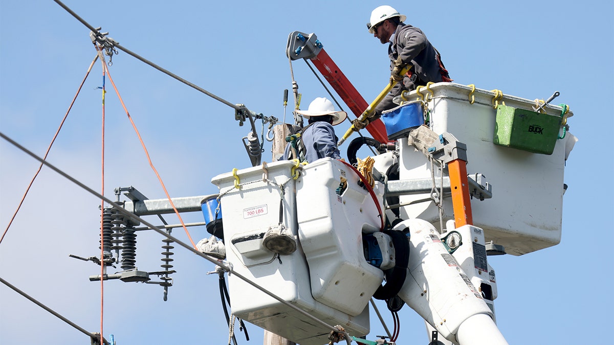 Electricians restoring power.