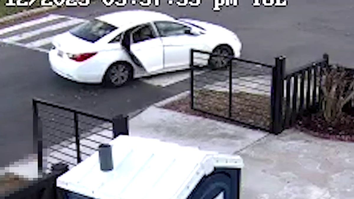 White car leaving crime scene