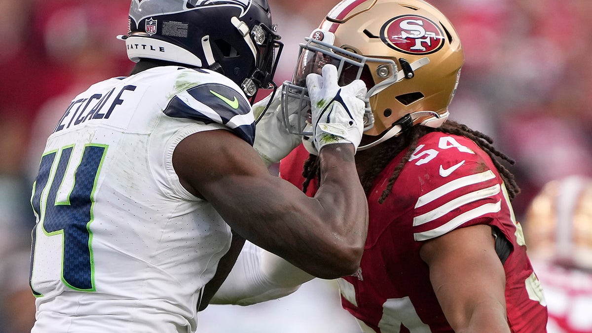 DK Metcalf and Fred Warner fight