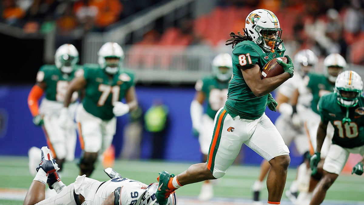 Florida A&M Rattlers player runs with the ball