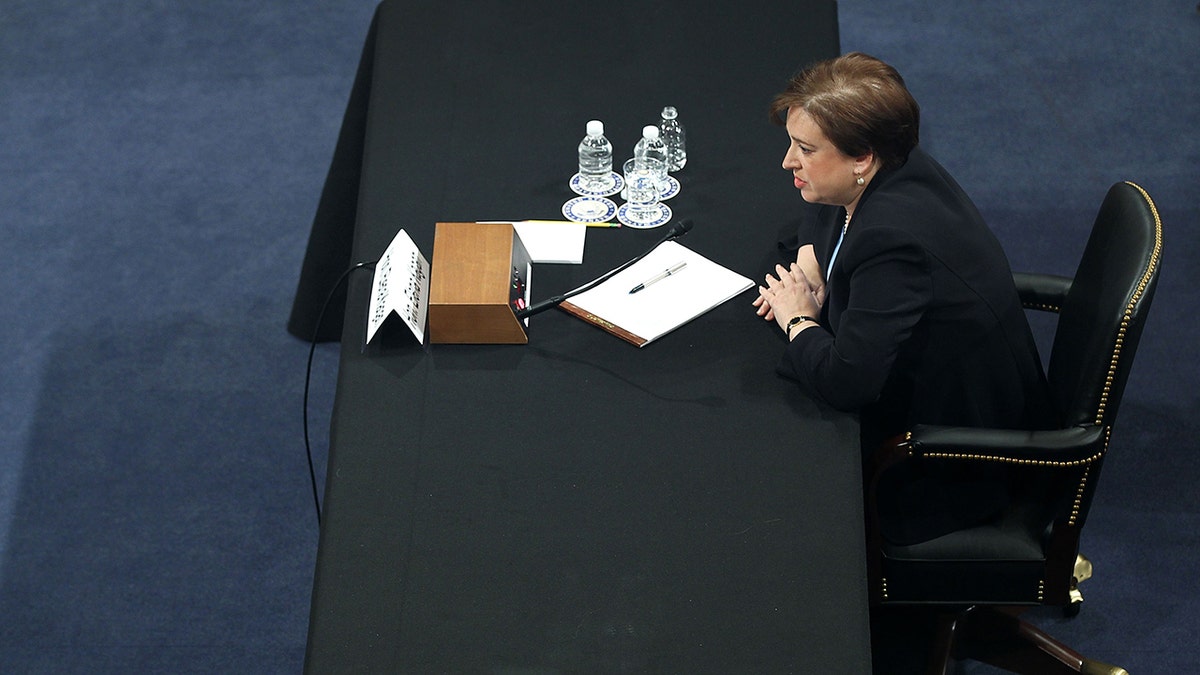 Elena Kagan sits at table at confirmation hearing 