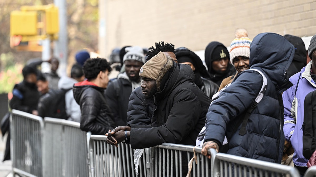 NYC migrants line up