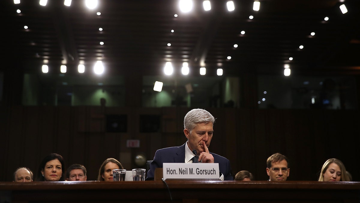 Neil Gorsuch looks down during confirmation hearing