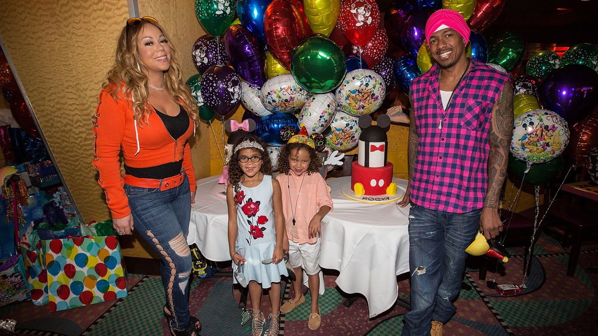 nick cannon with mariah carey and their kids at disneyland