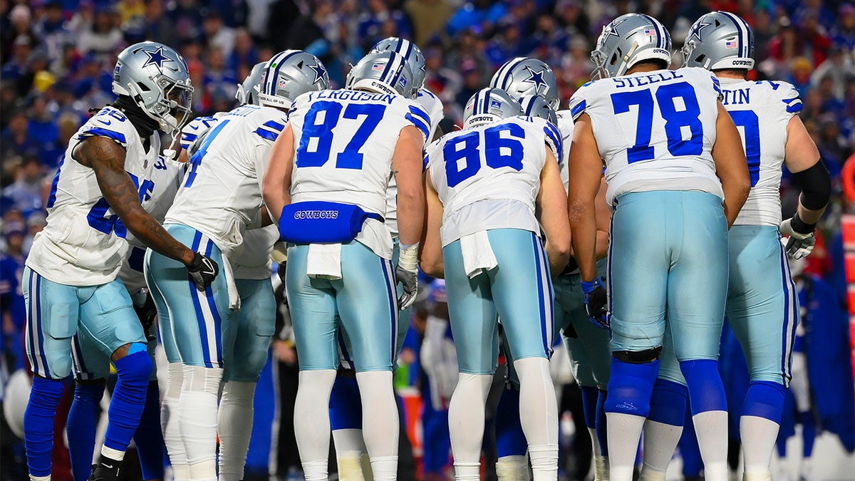 Cowboys players huddle up