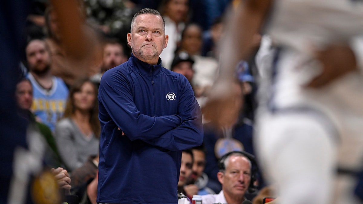 Michael Malone watches his team
