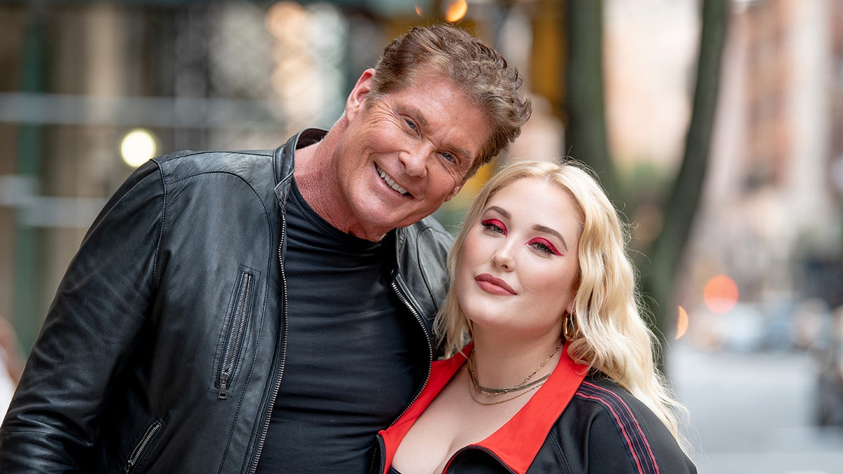 David Hasselhoff smiling next to his daughter in an outdoor photo