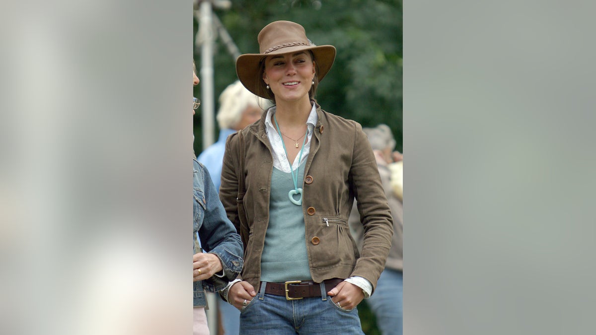 Kate Middleton wearing a brown hat and casual clothes