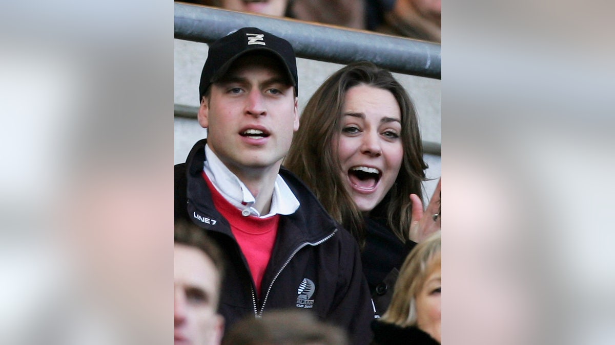 Prince William and Kate Middleton watching a game and cheering their team on