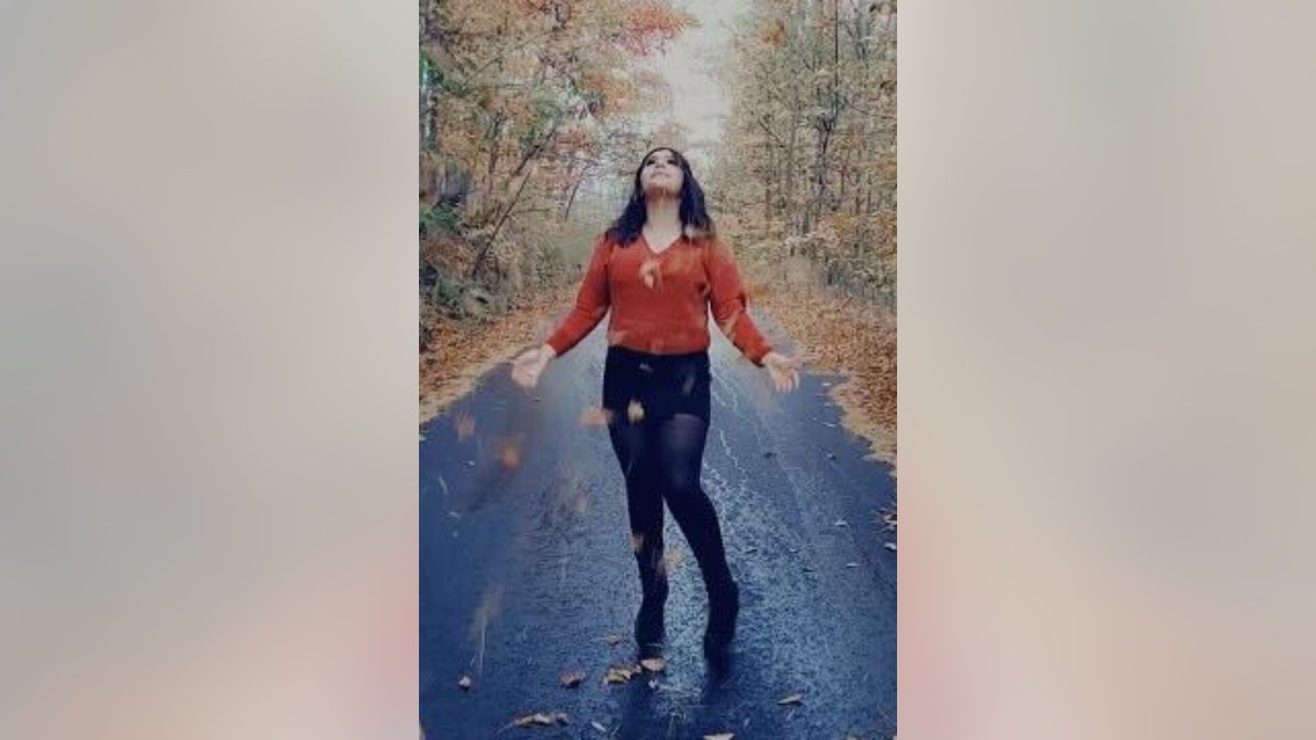 Lizbeth Medina catches falling leaves
