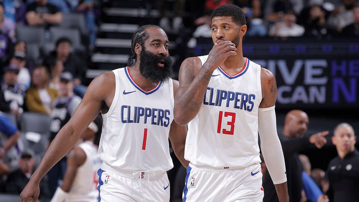 James Harden and Paul George talk on court