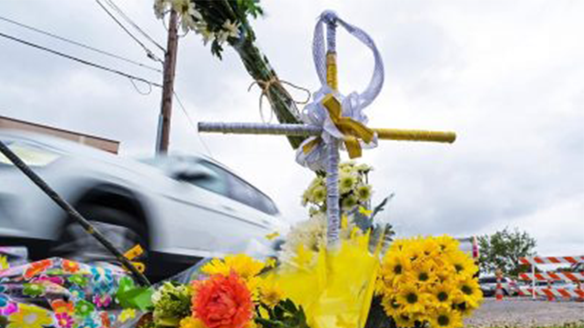 Flowers in honor of Linda Frickey, who was killed during a carjacking