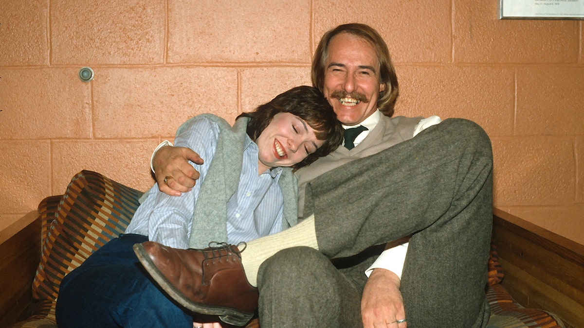 John Phillips with his arm around Mackenzie Phillips