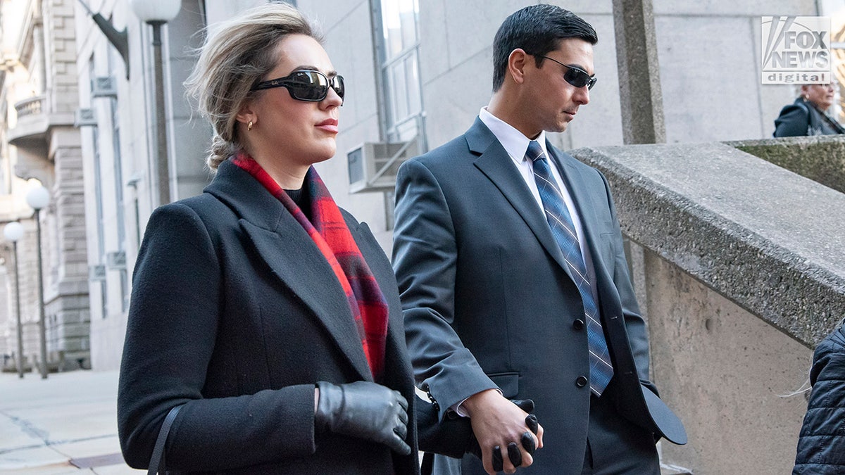 Matthew Nilo and his fiancé, Laura Griffin, depart the Suffolk County Superior Courthouse