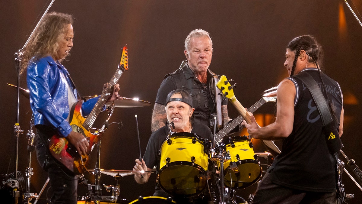Kirk Hammett, Lars Ulrich, James Hetfield and Robert Trujillo of Metallica perform on stage