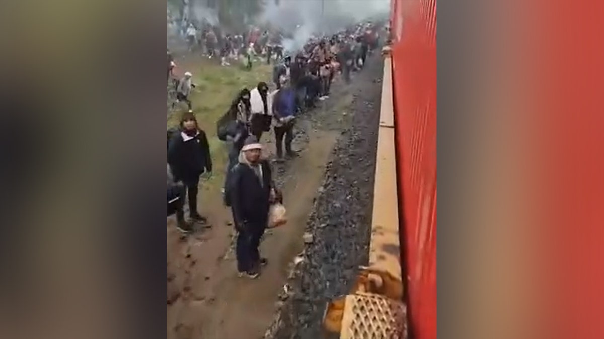Migrants wait for train