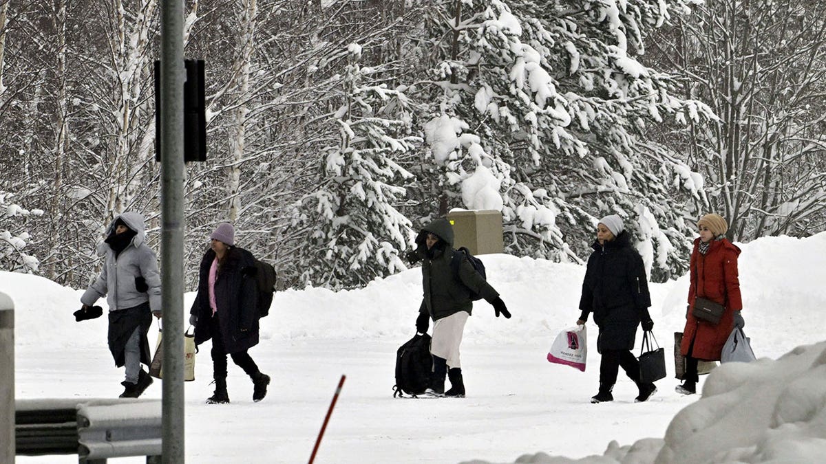 Migrants at border check point