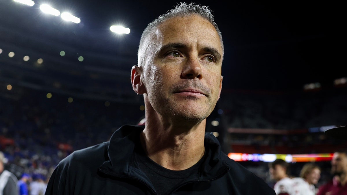 Mike Norvell walks off