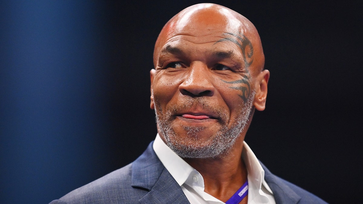 Mike Tyson looks towards the stage