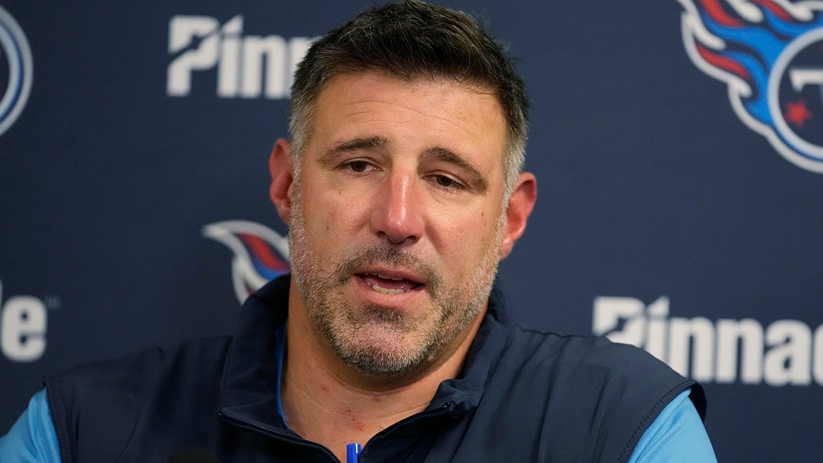 Mike Vrabel talks to reporters