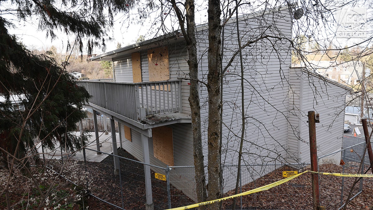 Utility workers inspect the house where four University of Idaho students were fatally stabbed in Moscow, Idaho