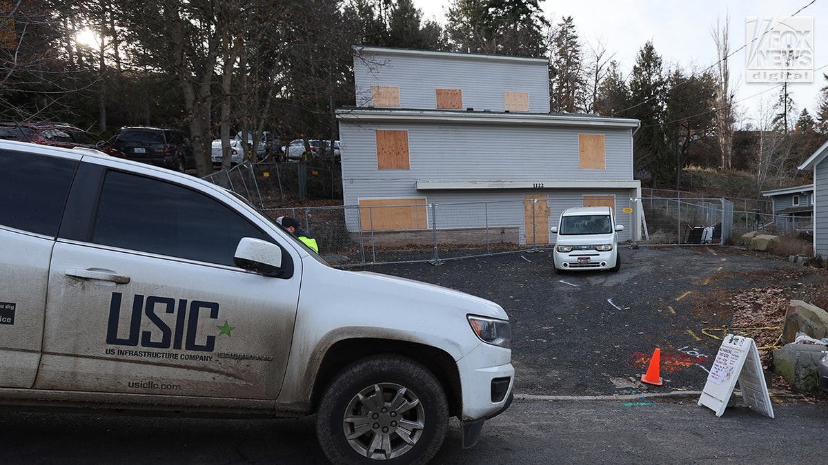 Utility workers inspect the house where four University of Idaho students were fatally stabbed in Moscow, Idaho