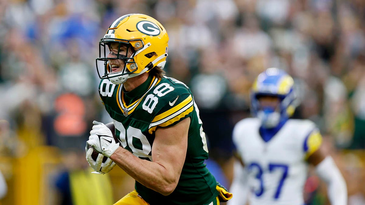 Luke Musgrave runs during a Packers game