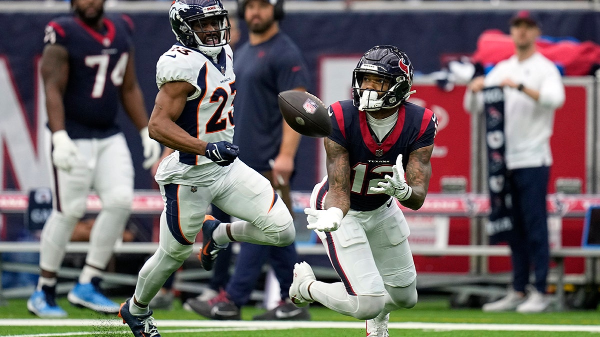 Nico Collins catches a pass