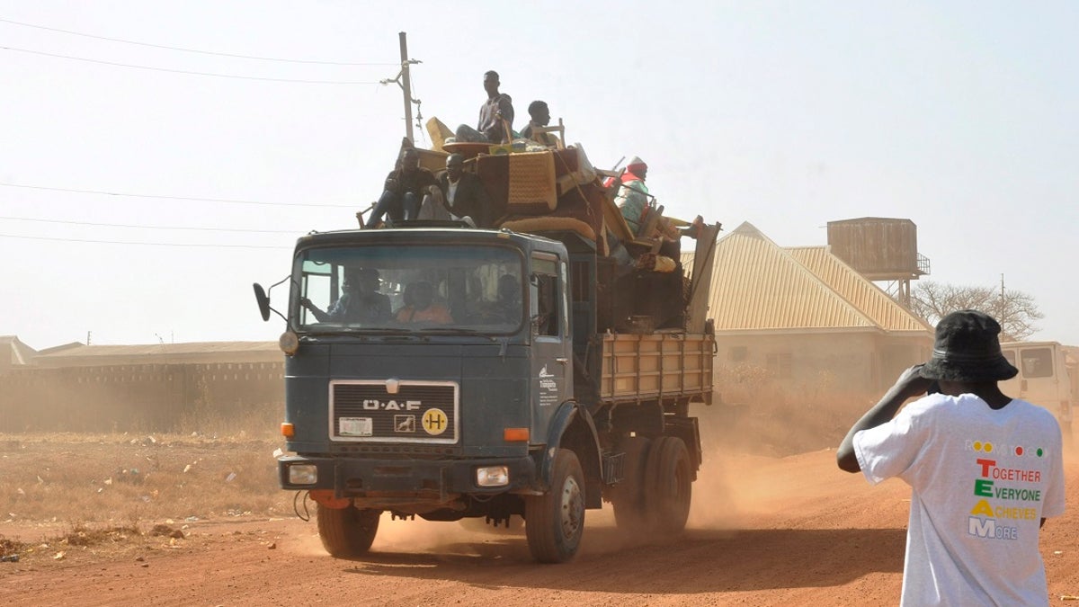 Nigerians in a large truck