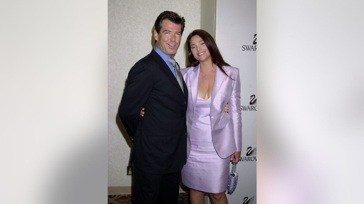 PIerce Brosnan and Keely Shaye Smith posing together