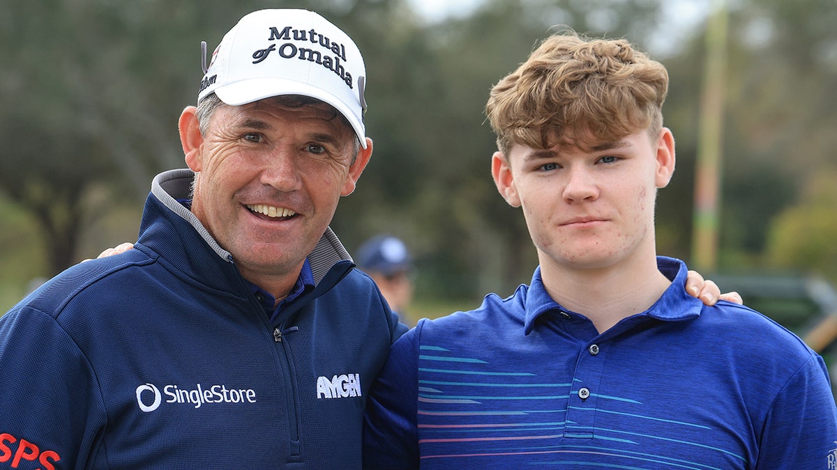 Padraig Harrington poses with his son