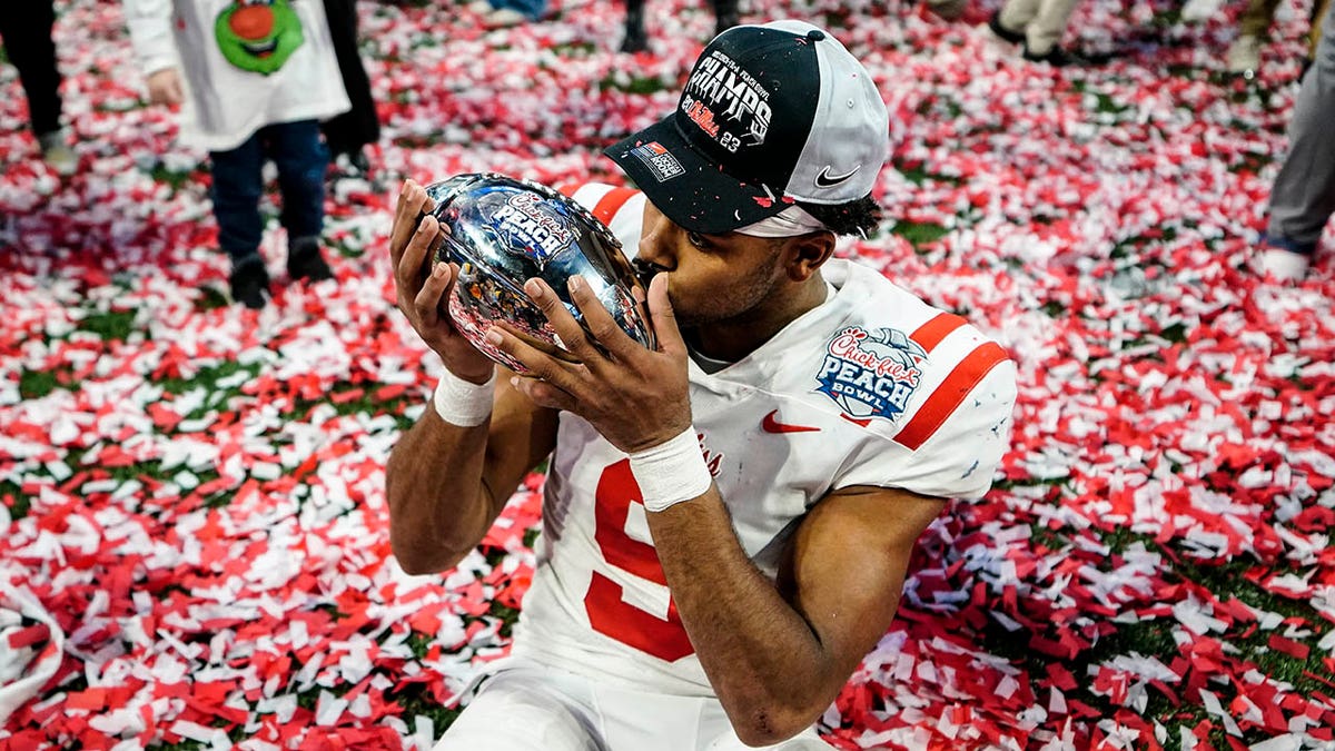 Ole Miss player celebrates Peach Bowl victory