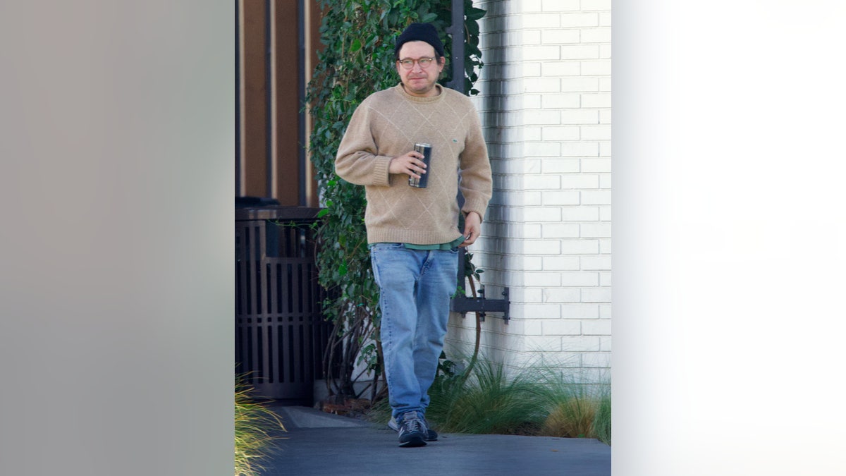 Jonathan Taylor Thomas walking on the street