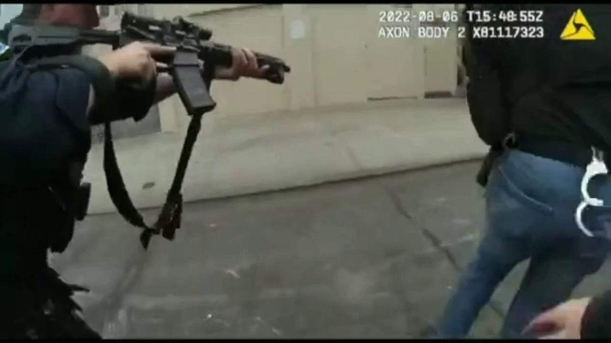San Francisco Police officers with guns drawn