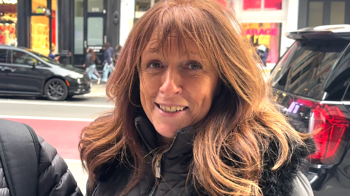 woman standing on sidewalk in new york talking about best present