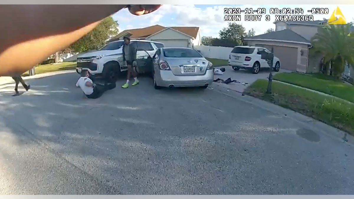 Florida cops on ground after getting hit by car