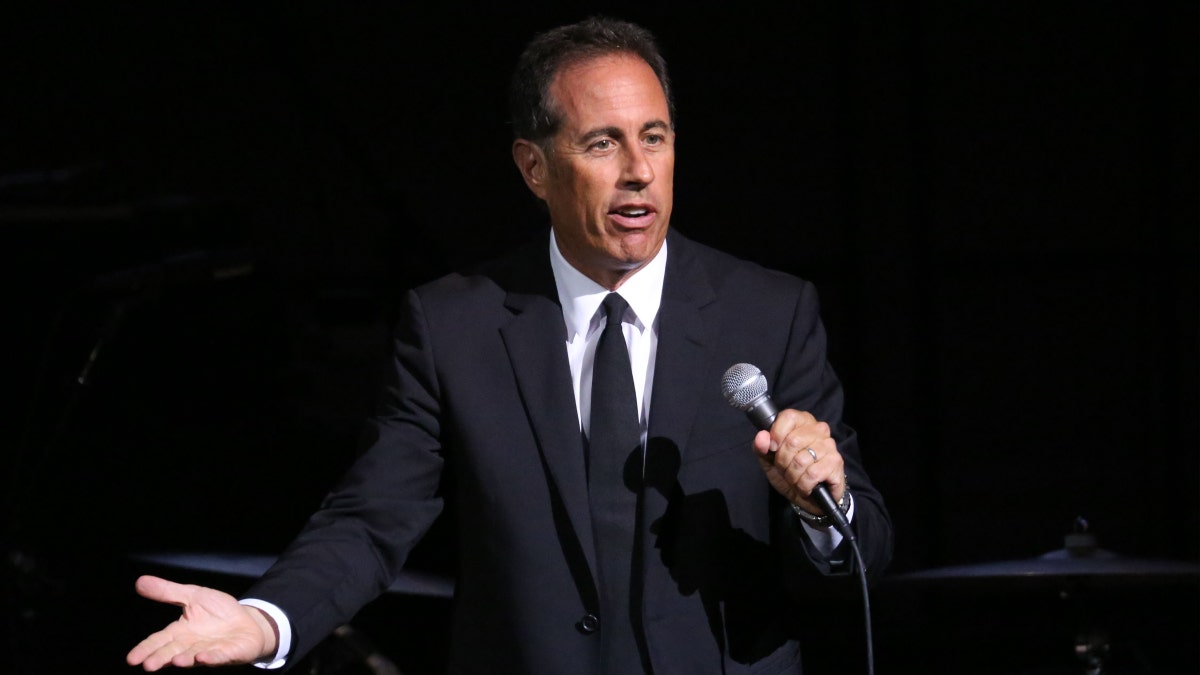 Jerry Seinfeld performing connected stage
