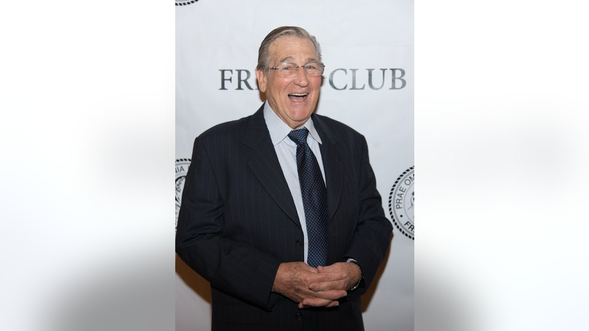 Shecky Greene smiling on the red carpet