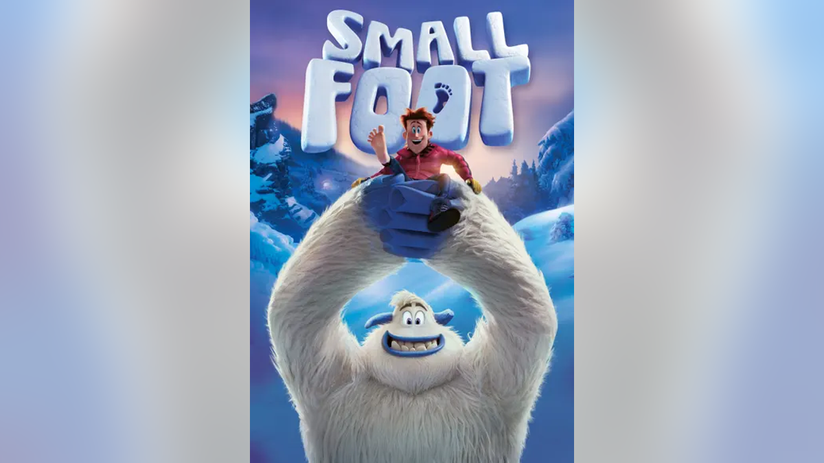 Cover of "Smallfoot" with boy in the air with snow creature
