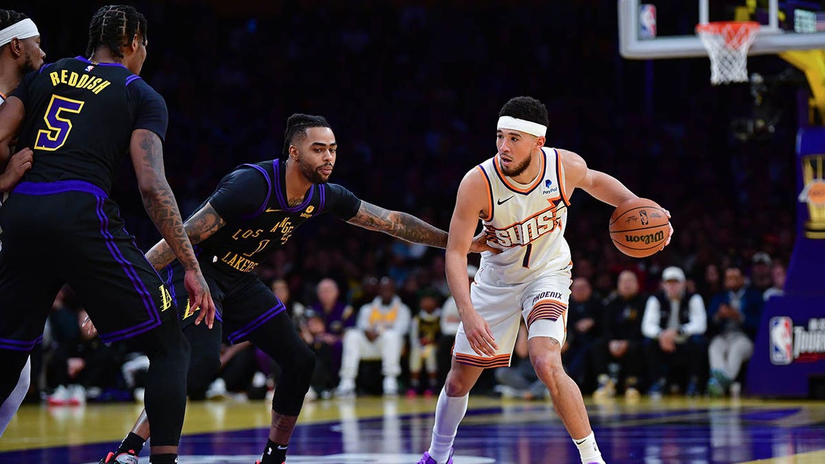 Devin Booker moves the basketball during a game