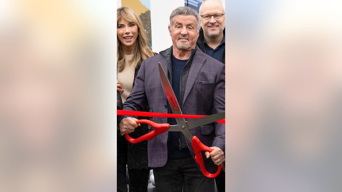Sylvester Stallone cuts the ceremonial ribbon on "Rocky Day" in Philadelphia.
