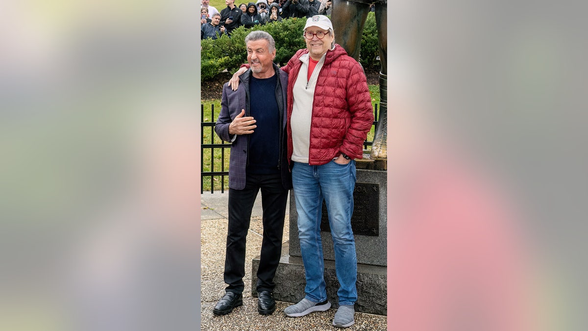Sylvester Stallone and Chevy Chase pose for a photo on "Rocky Day".