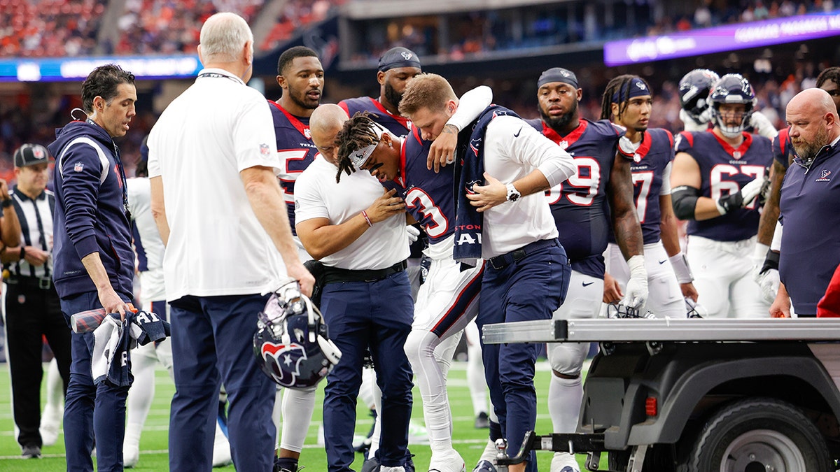 Texans' emerging star Tank Dell out for season after fracturing fibula: reports 1 Tank Dell helped on medical cart