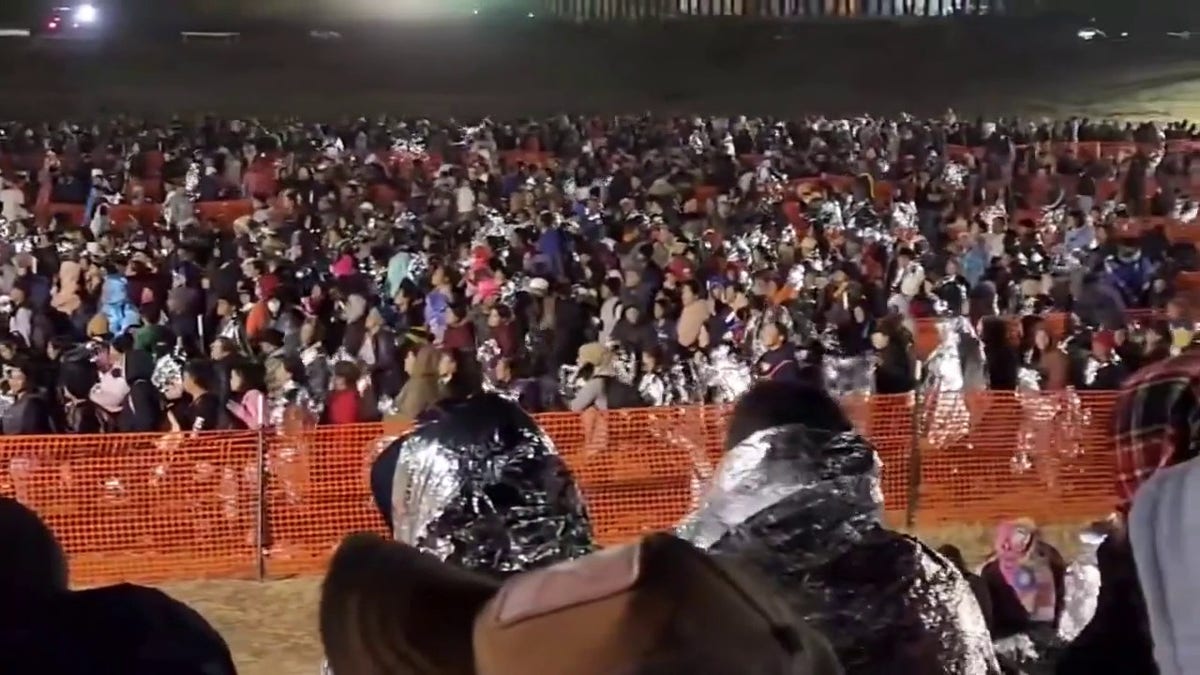 Migrants waiting to be processed