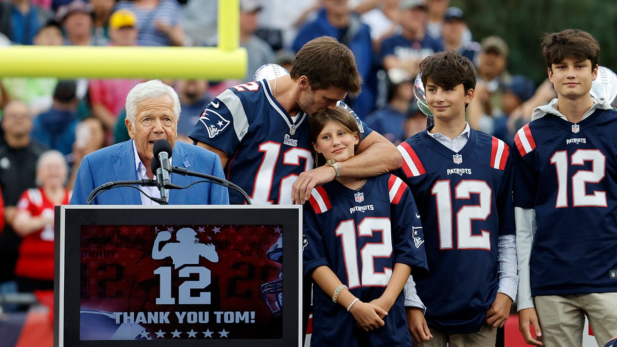 Tom Brady kisses daughter's head