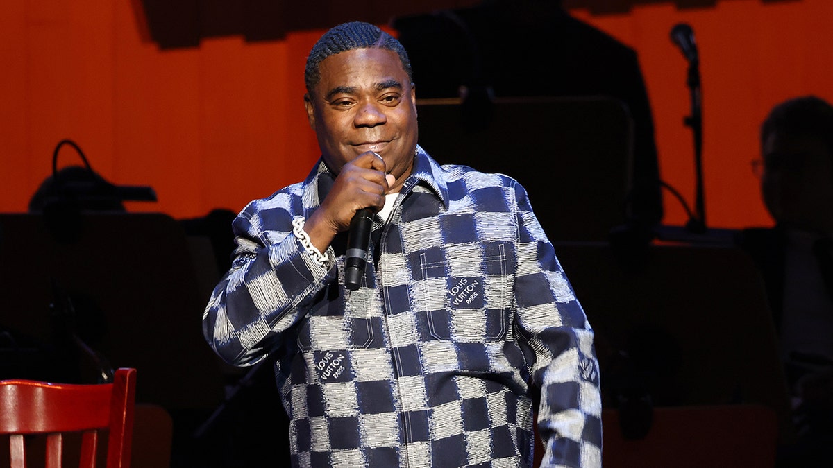 Tracy Morgan on stage holding a microphone