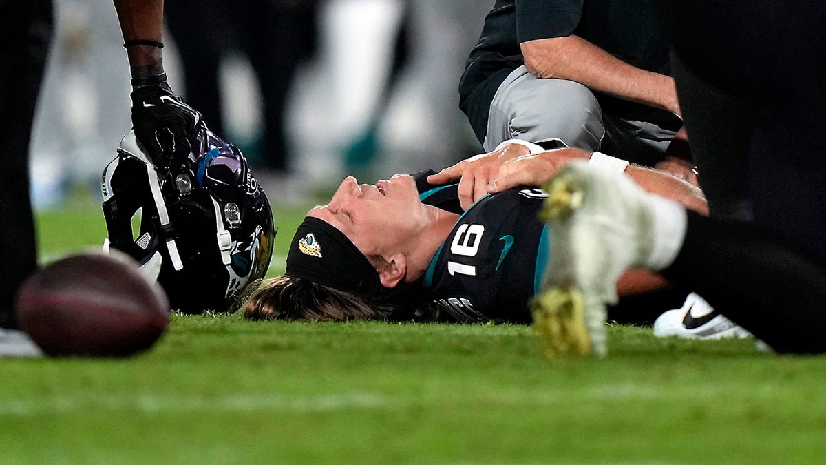 Trevor Lawrence down on field in pain